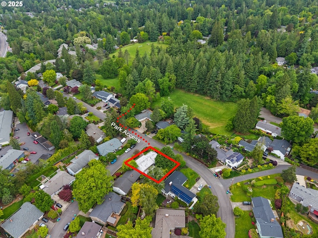 aerial overview of property's location featuring property boundaries highlighted and nearby suburban area