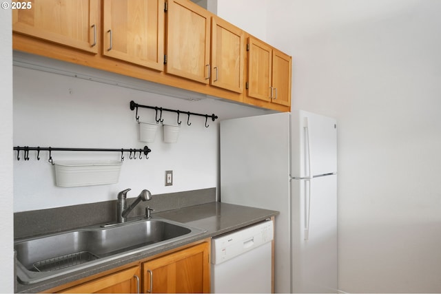 1910 SW 18th Ave Unit 34, Portland, OR 97201 - kitchen featuring white appliances and dark countertops