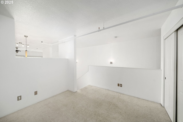 1910 SW 18th Ave Unit 34, Portland, OR 97201 - unfurnished room featuring carpet floors and a textured ceiling