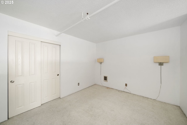 1910 SW 18th Ave Unit 34, Portland, OR 97201 - additional living space with carpet floors and a textured ceiling