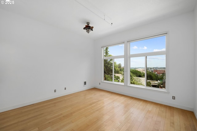 1910 SW 18th Ave Unit 34, Portland, OR 97201 - spare room with light wood-style flooring and baseboards