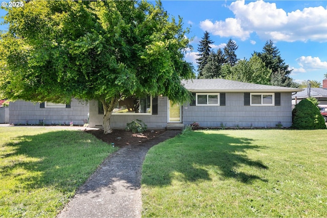 single story home featuring a front lawn and roof with shingles