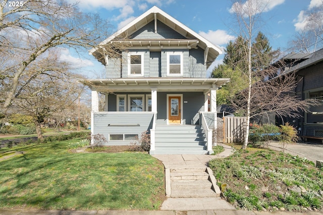 view of front of property featuring a porch and a front lawn