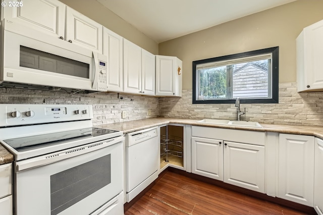 kitchen featuring white cabinetry, white appliances, sink, and decorative backsplash