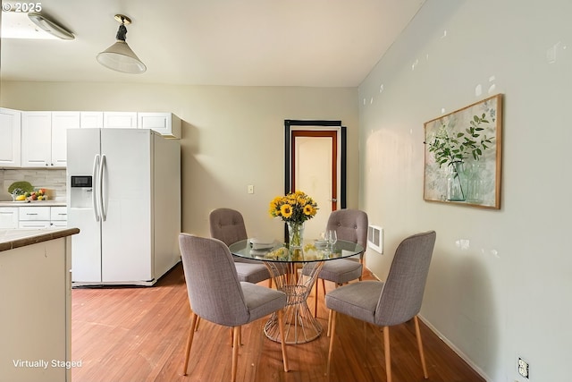 dining area featuring light wood-type flooring