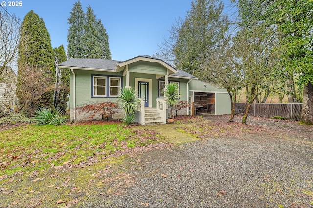 view of front of home featuring a carport