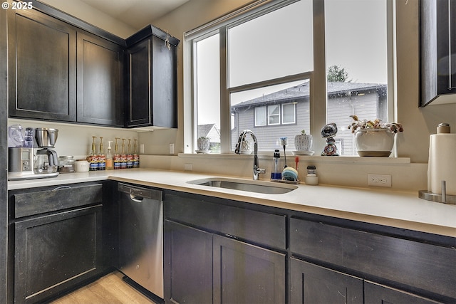 475 NE Liberty Ave, Gresham, OR 97030 - kitchen with stainless steel dishwasher, light countertops, and light wood finished floors
