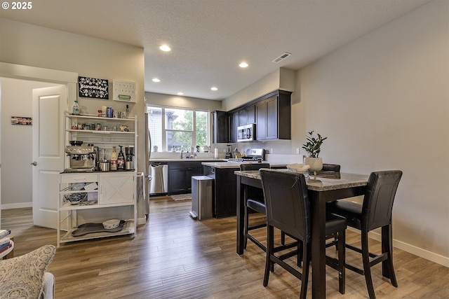 475 NE Liberty Ave, Gresham, OR 97030 - dining area featuring wood finished floors and recessed lighting