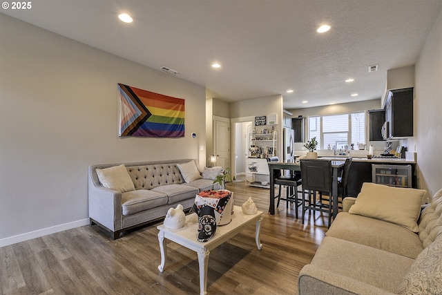 475 NE Liberty Ave, Gresham, OR 97030 - living room with wine cooler, wood finished floors, and recessed lighting