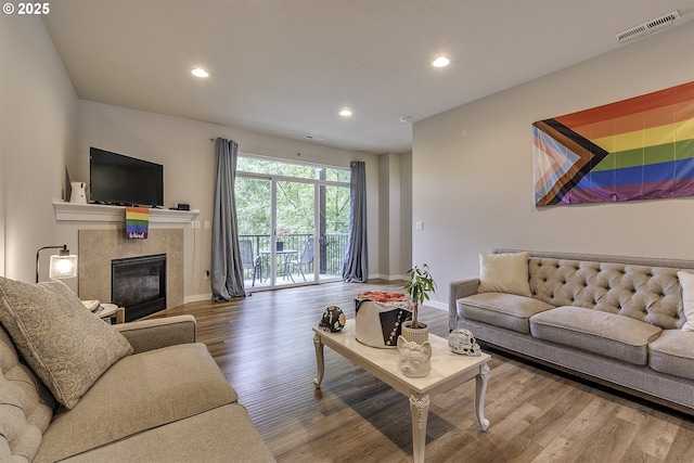 475 NE Liberty Ave, Gresham, OR 97030 - living room featuring recessed lighting, wood finished floors, and a tile fireplace