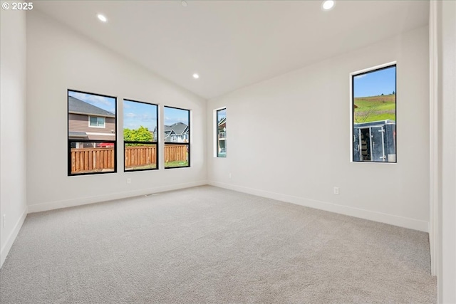 750 N V St, Washougal, WA 98671 - spare room featuring recessed lighting, healthy amount of natural light, carpet, lofted ceiling, and baseboards
