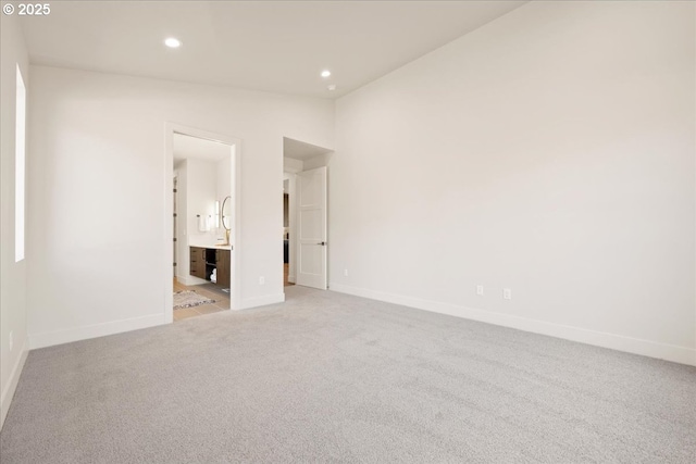 750 N V St, Washougal, WA 98671 - empty room with recessed lighting, light colored carpet, baseboards, and vaulted ceiling