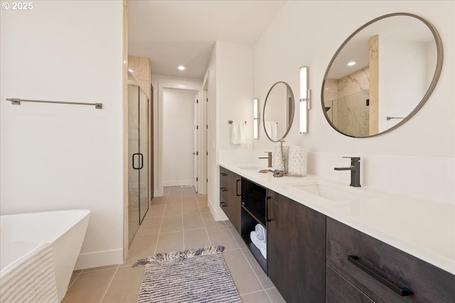 750 N V St, Washougal, WA 98671 - full bath featuring a shower stall, a soaking tub, double vanity, tile patterned flooring, and baseboards