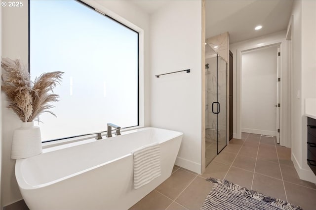 750 N V St, Washougal, WA 98671 - bathroom with a shower stall, vanity, a soaking tub, tile patterned flooring, and recessed lighting