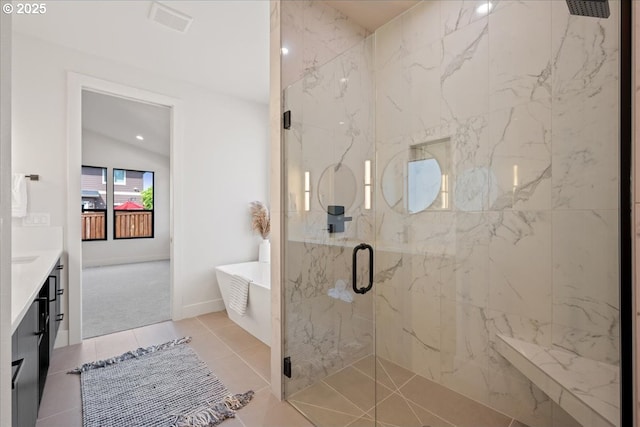 750 N V St, Washougal, WA 98671 - full bathroom featuring a marble finish shower, a freestanding bath, vanity, tile patterned floors, and baseboards