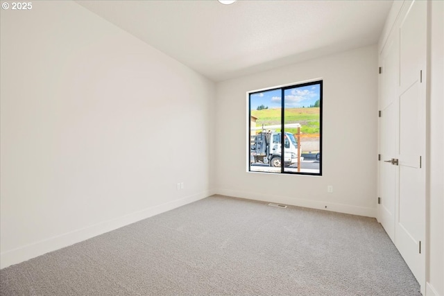 750 N V St, Washougal, WA 98671 - unfurnished bedroom featuring light colored carpet and baseboards