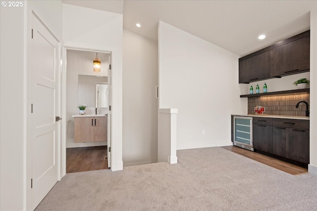 750 N V St, Washougal, WA 98671 - indoor dry bar featuring beverage cooler, carpet flooring, recessed lighting, and baseboards