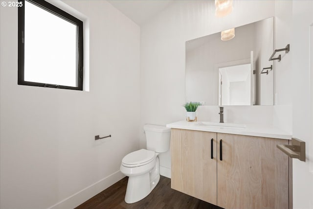 750 N V St, Washougal, WA 98671 - half bath featuring baseboards, wood finished floors, toilet, and vanity
