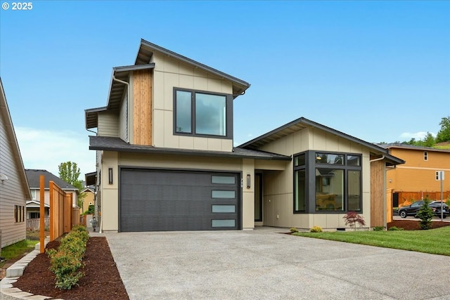 750 N V St, Washougal, WA 98671 - contemporary house with a garage, driveway, board and batten siding, fence, and crawl space