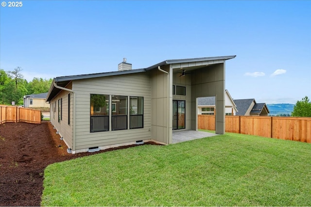 750 N V St, Washougal, WA 98671 - back of property featuring a ceiling fan, a chimney, and a patio area
