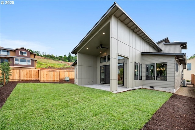 750 N V St, Washougal, WA 98671 - back of property with ceiling fan, a patio, and board and batten siding