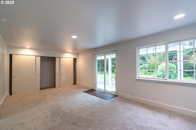 88771 Tokyo Ln, Bandon, OR 97411 - unfurnished bedroom featuring access to exterior, carpet floors, recessed lighting, and a closet