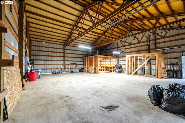 88771 Tokyo Ln, Bandon, OR 97411 - garage featuring metal wall and freestanding refrigerator