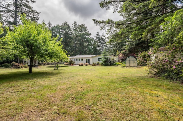 88771 Tokyo Ln, Bandon, OR 97411 - view of grassy yard featuring a storage shed
