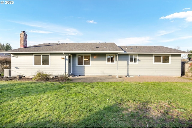 back of house featuring a patio, a yard, and central AC