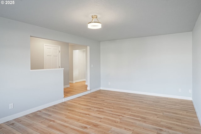 spare room featuring light hardwood / wood-style floors