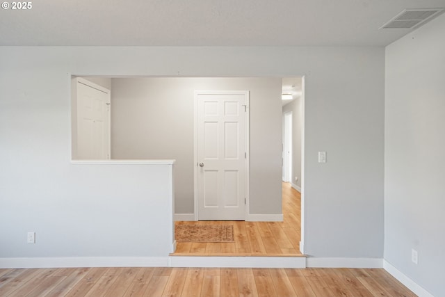 spare room with light wood-type flooring