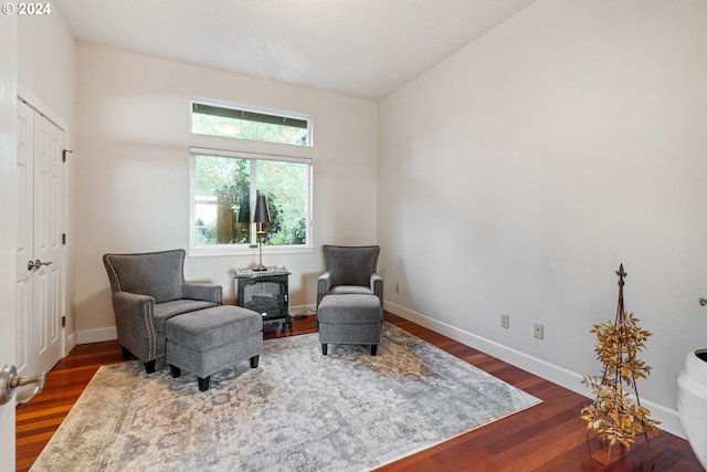 6904 SW Joshua Ct, Powell Butte, OR 97753 - living area with dark wood-style flooring and baseboards