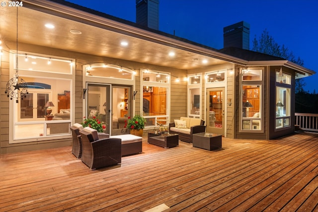 6904 SW Joshua Ct, Powell Butte, OR 97753 - deck at twilight featuring an outdoor living space