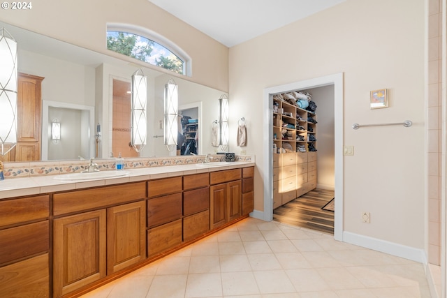 6904 SW Joshua Ct, Powell Butte, OR 97753 - bathroom with a walk in closet and double vanity