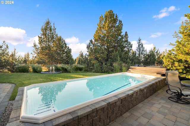 6904 SW Joshua Ct, Powell Butte, OR 97753 - swimming pool featuring a yard, a wooden deck, and a patio area