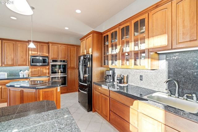 6904 SW Joshua Ct, Powell Butte, OR 97753 - kitchen featuring black appliances, backsplash, light tile patterned flooring, glass insert cabinets, and recessed lighting