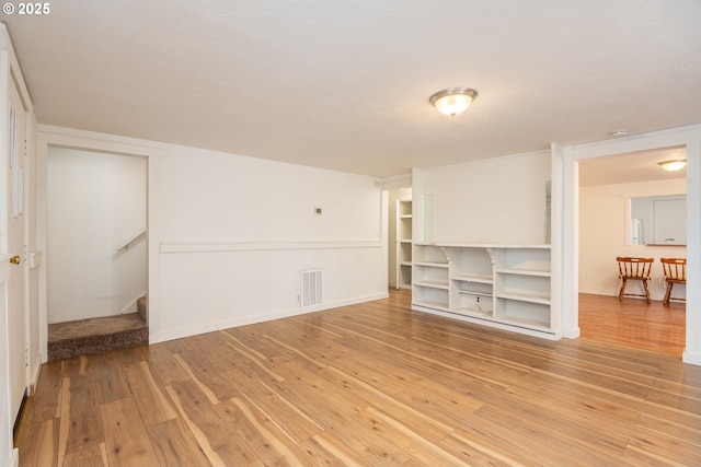 unfurnished living room with light wood-type flooring