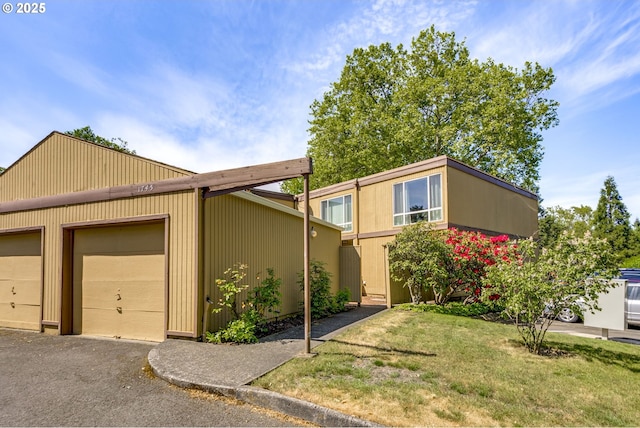 1745 NW Lakeway Ln, Beaverton, OR 97006 - view of front of house with an outbuilding and a front yard