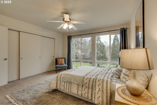 bedroom featuring a closet, carpet flooring, and a ceiling fan