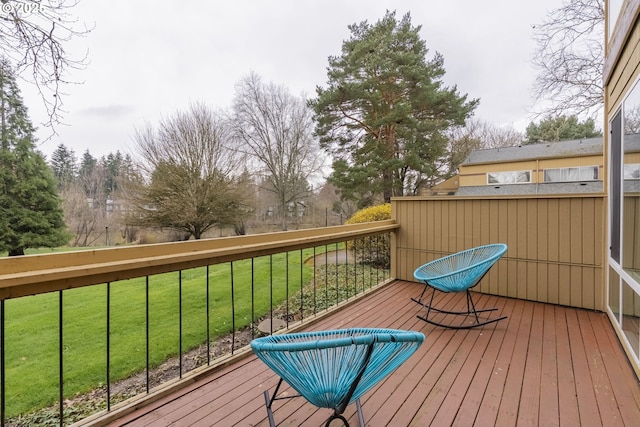 wooden terrace with a yard