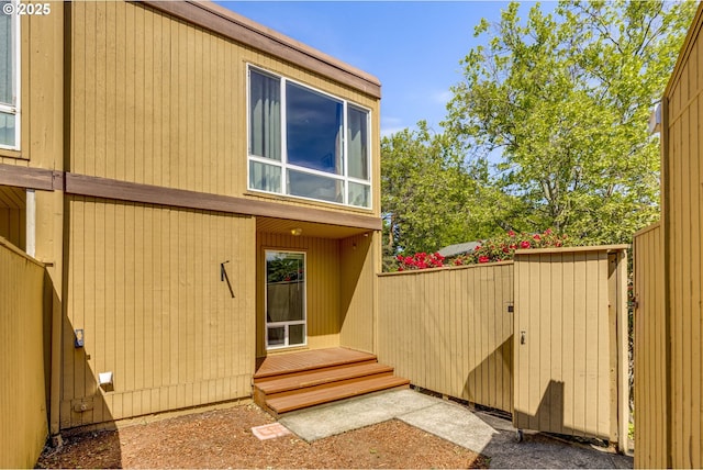 1745 NW Lakeway Ln, Beaverton, OR 97006 - view of property exterior with a storage shed, fence, and an outbuilding