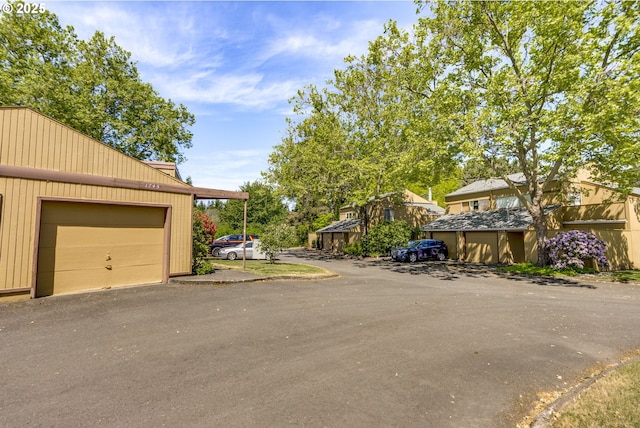 1745 NW Lakeway Ln, Beaverton, OR 97006 - view of side of home with an outdoor structure and a garage