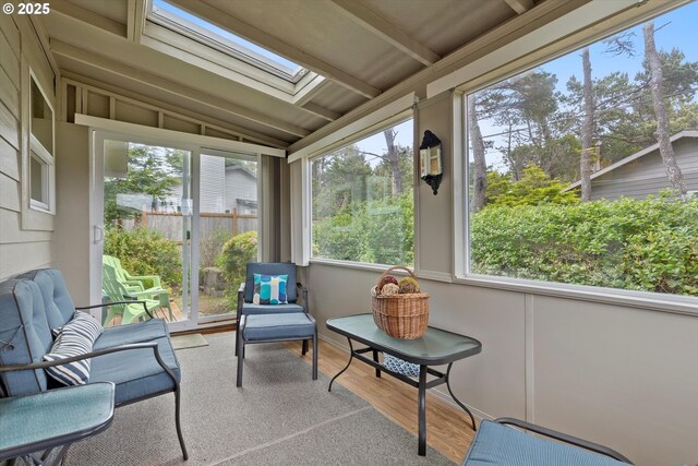 320 El Rotundo Ave, Lincoln City, OR 97367 - sunroom with a skylight, lofted ceiling, and wood finished floors