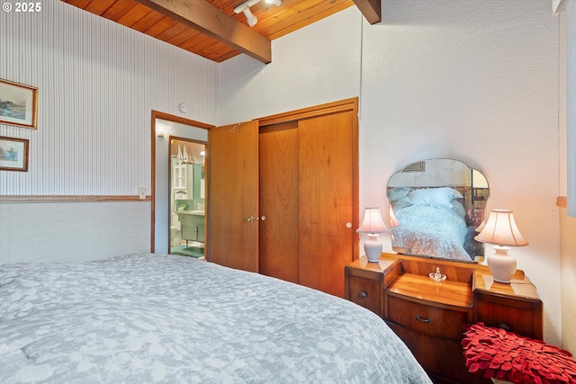 320 El Rotundo Ave, Lincoln City, OR 97367 - bedroom with wooden ceiling with exposed beams, a closet, and ensuite bath