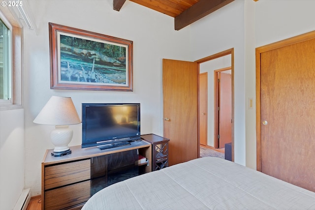 320 El Rotundo Ave, Lincoln City, OR 97367 - bedroom with a baseboard heating unit and wood ceiling with exposed beams