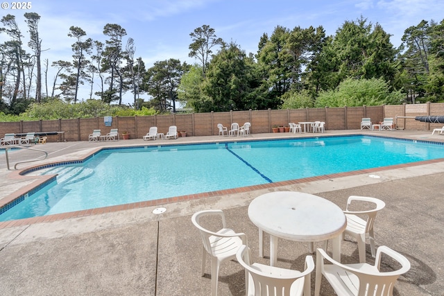 320 El Rotundo Ave, Lincoln City, OR 97367 - community pool featuring a patio and view of scattered trees