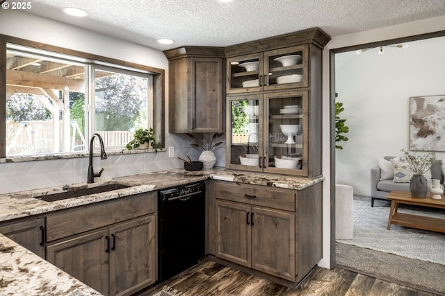 2005 SW Stella Way, Troutdale, OR 97060 - kitchen with black dishwasher, a sink, glass insert cabinets, light stone counters, and a textured ceiling