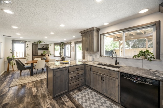 2005 SW Stella Way, Troutdale, OR 97060 - kitchen featuring dishwasher, a sink, a peninsula, recessed lighting, and a textured ceiling
