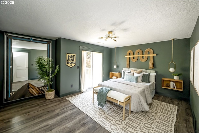 2005 SW Stella Way, Troutdale, OR 97060 - bedroom featuring access to exterior, a textured ceiling, and wood finished floors