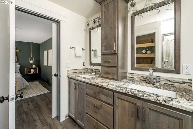 2005 SW Stella Way, Troutdale, OR 97060 - ensuite bathroom featuring double vanity, wood finished floors, and tasteful backsplash